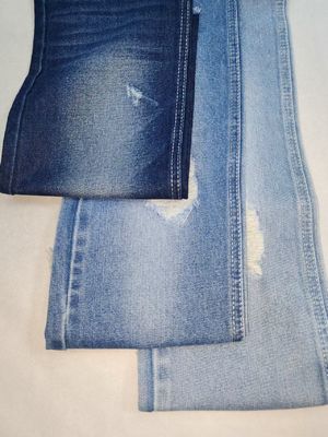 comprar Tejido vaquero de algodón poliéster de peso pesado de 11.4 oz, INDIGO OSCURO, con construcción 10+10*7 JSD3243 para jeans online manufacture