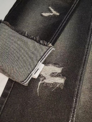 comprar Tejido de mezclilla estilo TWILL de 12.2OZ NEGRO/BLANCO con construcción 7*7 Para jeans de hombre online manufacture