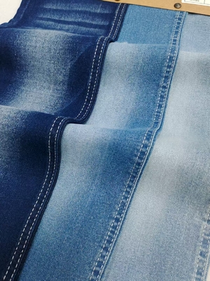 comprar Tejido vaquero de 8.4oz con tacto suave y alto contenido de spandex, estilo sarga, con construcción 12*21/70OE para jeans online manufacture